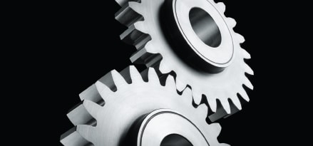 2 gears on black background