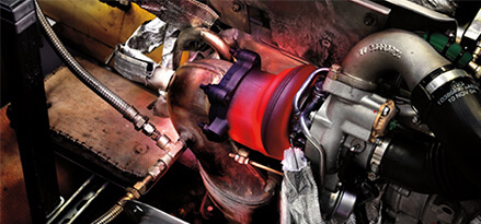 Turbocharger with red glow working in an engine