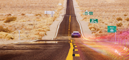 car with viz travelling on open road