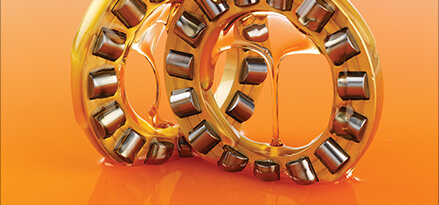2 orange bearings with oil dripping