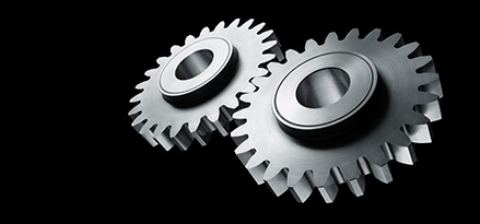 2 gears on black background