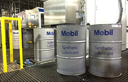 drums of Mobil SHC lubricants in factory