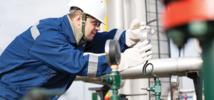 engineer inspecting a dial