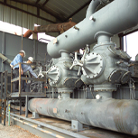 2 engineers on a gas compressor