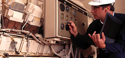 engineer checking nitration equipment in gas engine