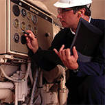 engineer checking nitration equipment in gas engine