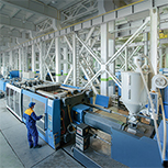 engineer with molding machines in plastics plant