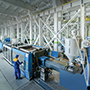 engineer with molding machines in plastics plant