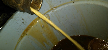 removing emulsion from system valve
