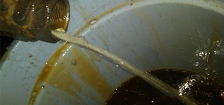 removing free water from system valve