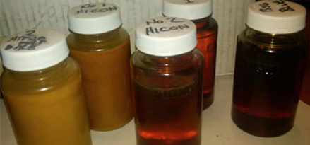 five bottles of different oil samples
