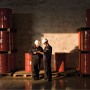 2 engineers with red barrels as background
