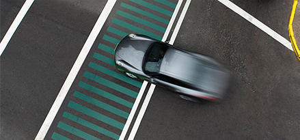 aerial view of fast black car driving