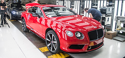 red bentley car on factory line