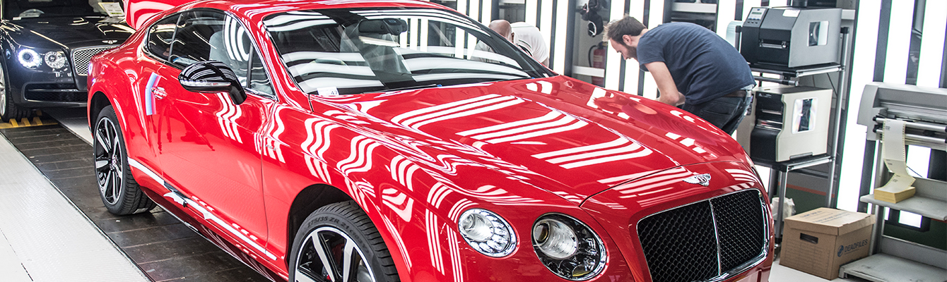 red bentley car on factory line