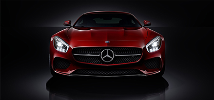 front view of red mercedes car on black background