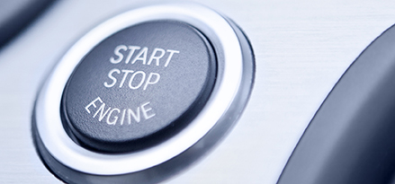 closeup of start-stop engine button in car