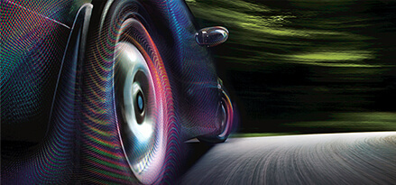 closeup of car tires with energy viz on road