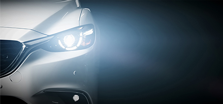 closeup of headlights of white car