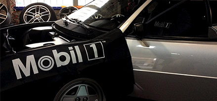 open hood of car with mobil 1 cover