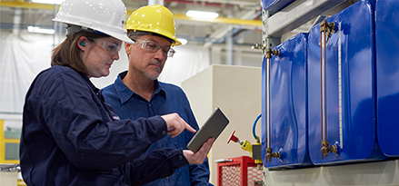 mobil serv engineer and customer discussing results with an ipad