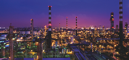 jurong refinery with lights at dusk